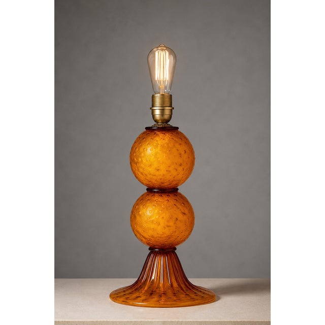 An exquisite mid-century modern artistic table lamp base crafted in murano, italy, during the 1970s. The piece features a...