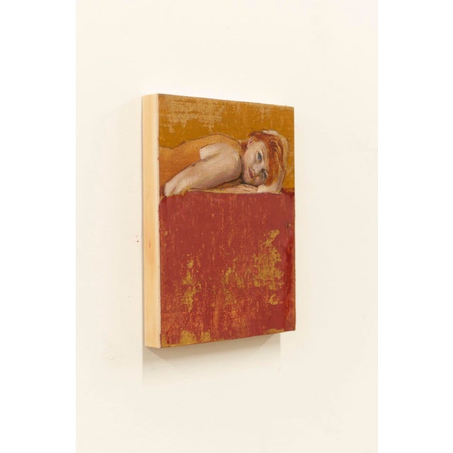 This artwork depicts a contemplative figure reclining against a backdrop of warm orange and deep red hues, creating a...