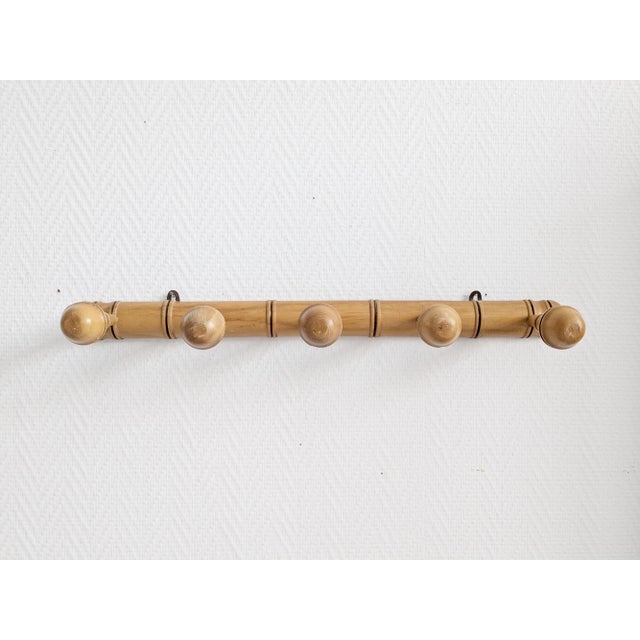 This French wall coat rack is a bamboo style coat rack made from solid wood. The five shaped coat hooks and the bamboo...