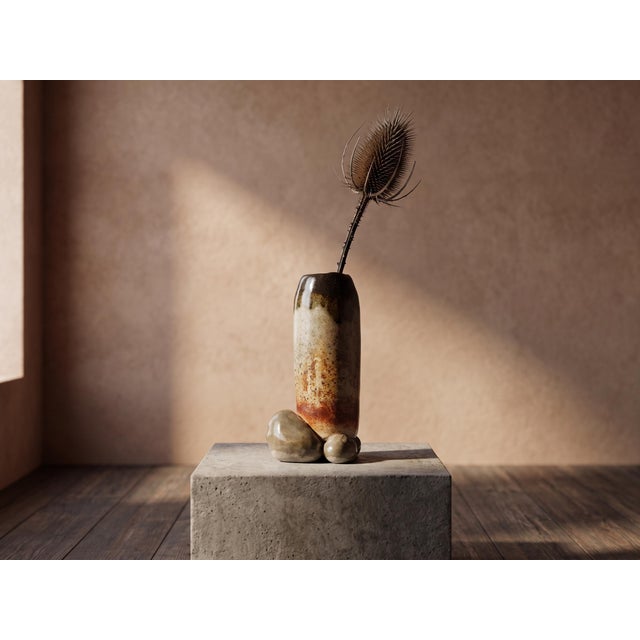 A compelling and sculptural studio stoneware vessel combining raw, earthy materiality with an undeniably provocative...