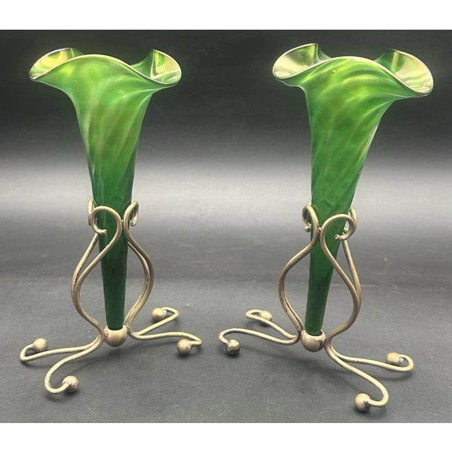 Each piece ranges in height from approximately 7 3/4 to 8 inches. Beautiful pair of glass epergne vases in metal stands....