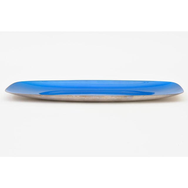 This vintage 1950's Reed and Barton silver plate elongated bowl or tray is sapphire blue enamel as the interior. The color...