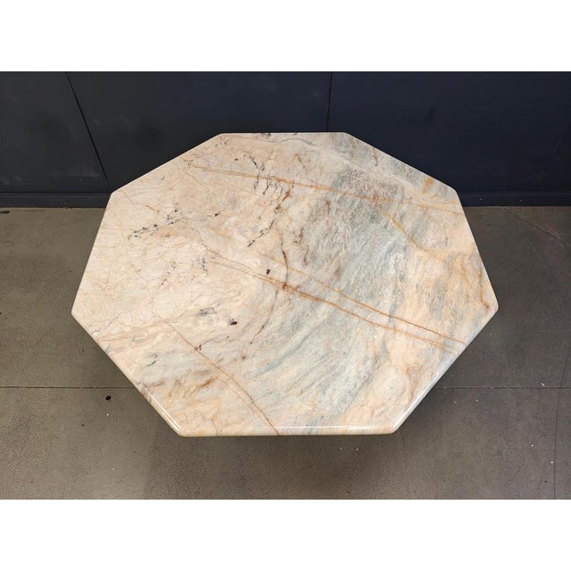 Beautiful dining table made from marble with a gorgeous natural pattern/vaining Very nice colours going between...