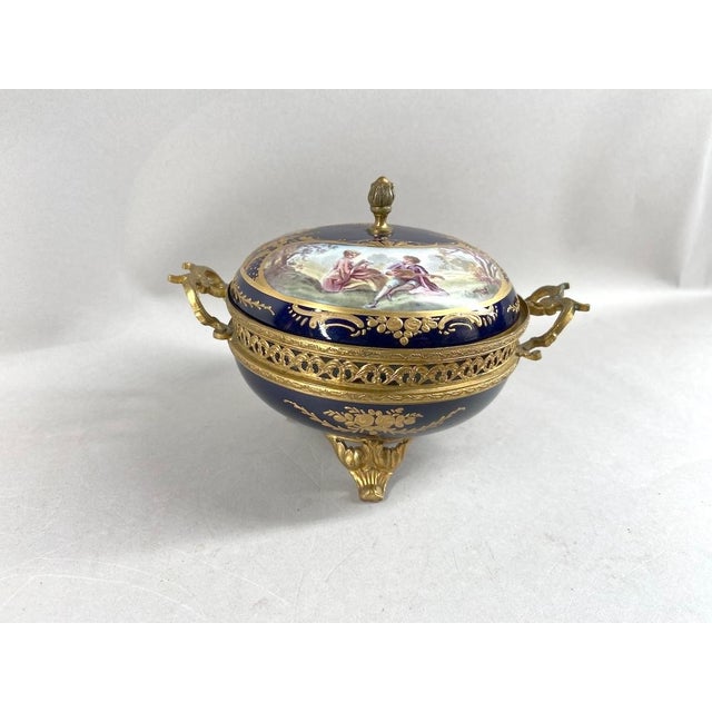 A refined early 20th-century French Sèvres-style porcelain covered dish / bowl, beautifully decorated in deep cobalt blue...