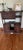 Architectural Chinese-style display cabinet with asymmetrical open shelving, enclosed compartments, carved panels and...