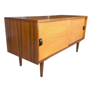 Restored 1960s Danish Modern Teak Cabinet With Sliding Doors and Tapered Legs For Sale