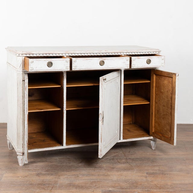 19th century Swedish sideboard, crafted in pine. The cabinet has a traditional three drawer over three door configuration,...