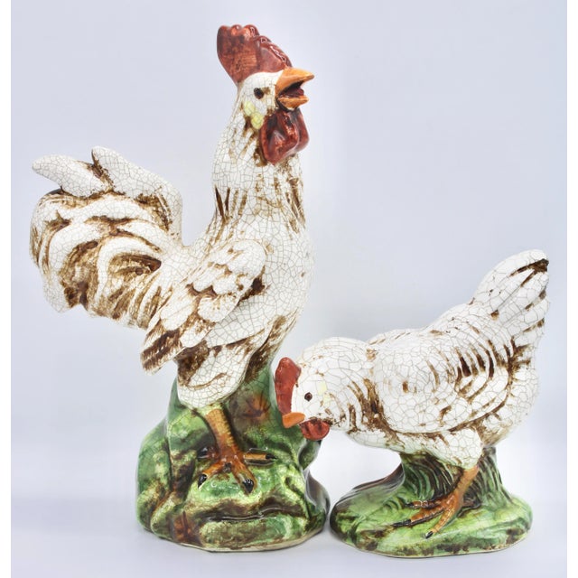 A superb pair of ceramic chickens, a rooster and hen. This is a fine, creamy white pair with bright green bases. There is...