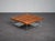 A refined ponton coffee table designed by osko + deichmann for ligne roset in 2006. The design combines a warm walnut...