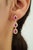 These drop earrings feature 2.05 carats of pear-cut Mozambique rubies set in 14K yellow gold. The ruby measuring 3.5 x 5.5...