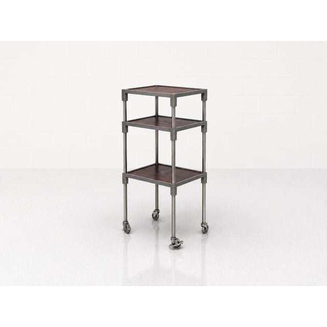 A functional serving cart/shelf trolley from ge-ra norm bauteile, featuring a clear industrial design language typical of...