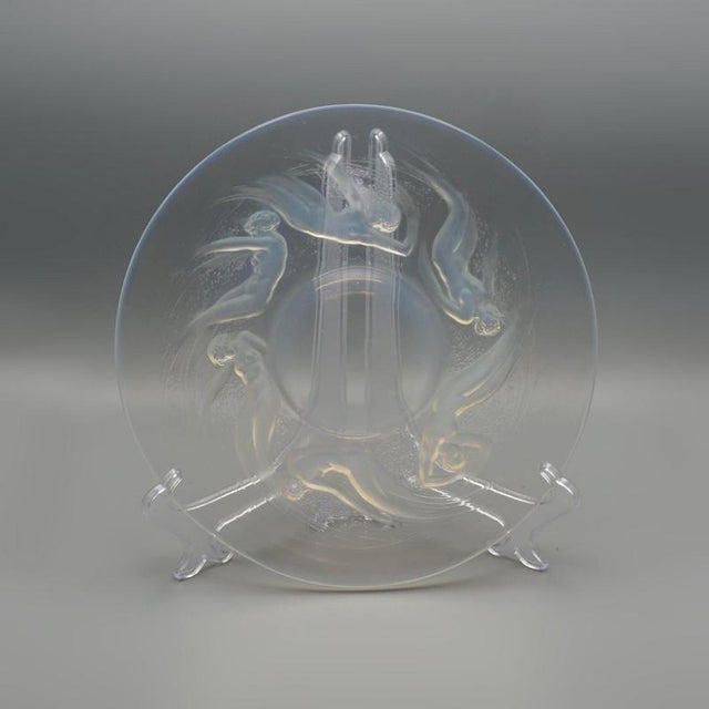 Ondines, an Art Deco blue opalescent glass plate, relief decorated with frolicking sea nymphs. Etched R Lalique France to...