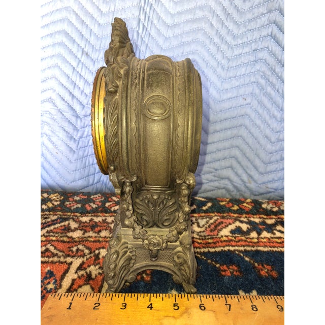 This beautifully aged ornate clock was manufactured by the Waterbury Clock Mfg. Company in Connecticut. I believe it’s...