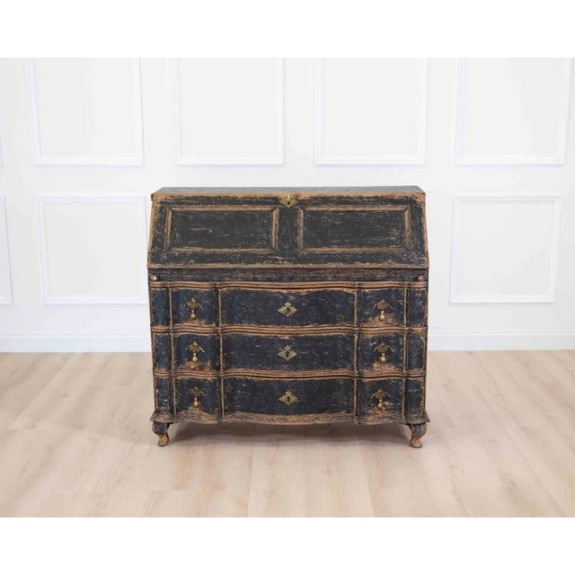 A refined 18th century Danish rococo secretaire featuring beautifully shaped proportions and elegant architectural...