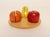 Creative Playthings wooden fruit puzzle, ca. late 1960s/early 1970s, USA. Composed of four orange pieces, three apple, and...