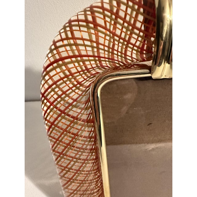 This beautiful vertical photo frame is purely in the tradition of Venetian glassmaking. The technique used to achieve this...