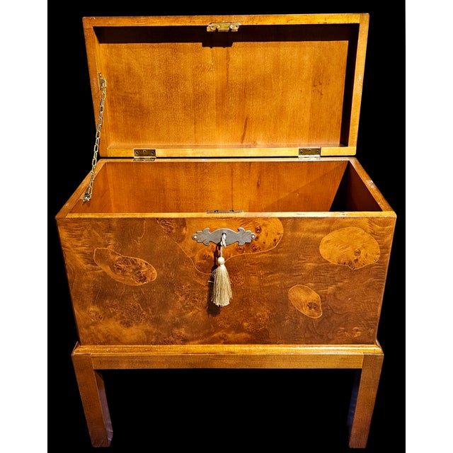 This Vintage Burlwood Chest on Stand is masterfully encased in a luscious burlwood veneer with a lovely whorling pattern...