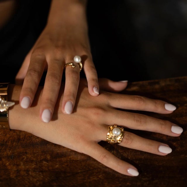 Elevate your style with the Divine Touch Pearl Gold Ring, a unique handmade design that blends timeless elegance with...