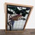 The stained-glass panel depicts a parrot sitting on a branch. The wood frame includes a hanging chair. Dimensions (in):...
