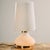 Limburg table lamp with brass details from the 1960s. The lamp’s shade and body are made of opaline glass, making it an...