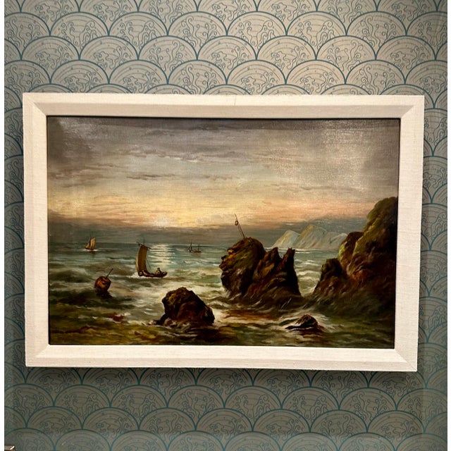 Moody antique oil painting, depicting maritime scene with ships navigating near a rugged coastline under the soft glow of...