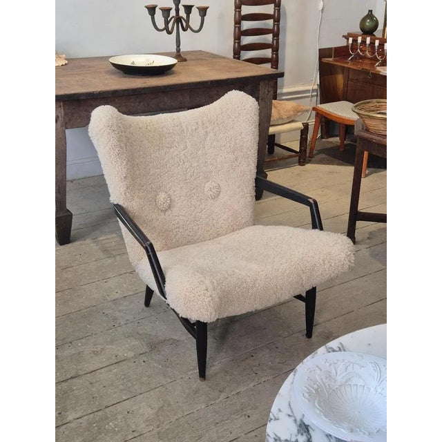 A rare armchair model attributed Svante Skogh, Stil & Form, Sweden 1950s. Beautiful sculptural wooden frame, colored...