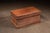 Rectangular pine blanket chest with a hinged lid and applied base molding, constructed with exposed hand-cut dovetail...