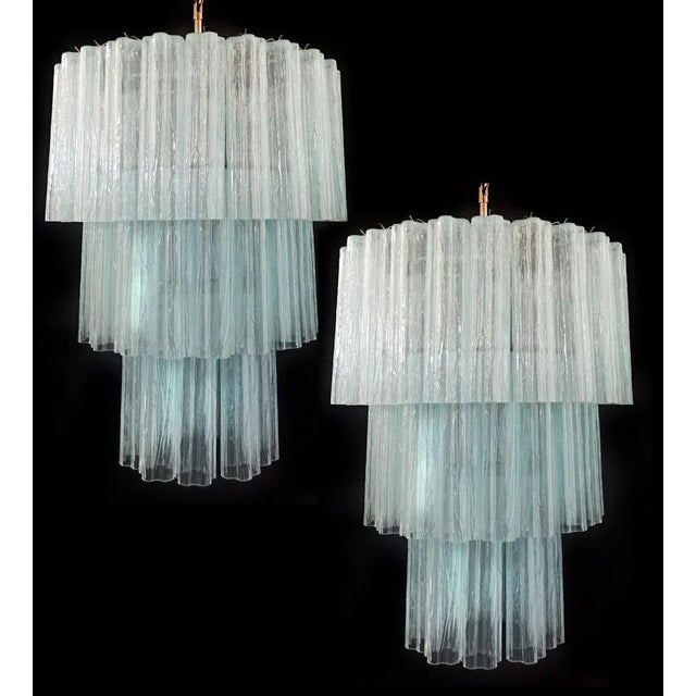 Pair italian vintage chandeliers in murano glass and nickel-plated metal structure. The armor polished nickel supports 52...