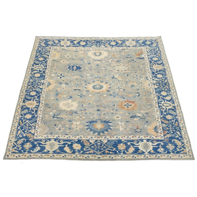 This stunning Modern Oushak style rug blends traditional Turkish design with a contemporary, airy color palette. Hand-...