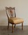A striking side or slipper chair with a pierced back splat carved as a radiant sun. The serpentine crest rail is carved...