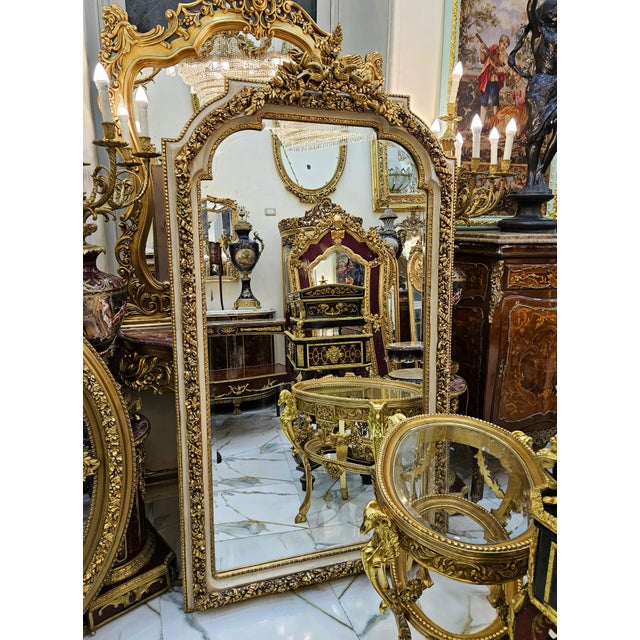 Make an unforgettable statement with this magnificent French Rococo floor mirror, exquisitely crafted with an ornate frame...