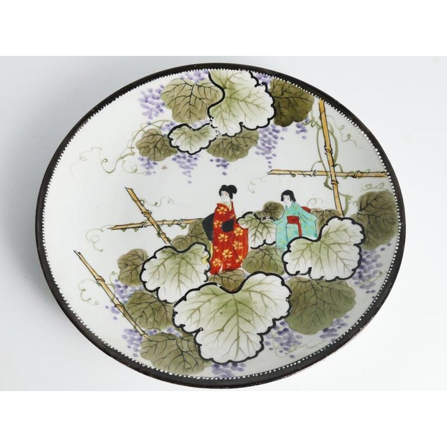 Meiji Hand-Painted Kutani Porcelain Charger with Women and Vine Arbor, 1920s For Sale - Image 11 of 18