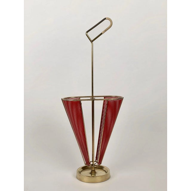 An umbrella stand designed and produced by Mathieu Mategot from the 1950's. The stand uses Mategot s own technique of...