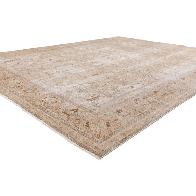 61352 Distressed Vintage Earth-Tone Persian Tabriz Rug, 09'10 x 12'07. This exceptional hand-knotted wool distressed...