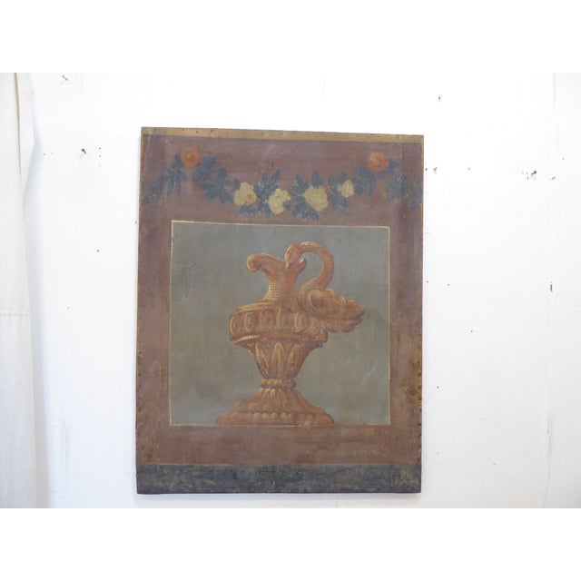 This fragment of an 18th Century French Screen is painted on linen and depicts a classical urn and measures 32.5"H x 25.75"W.