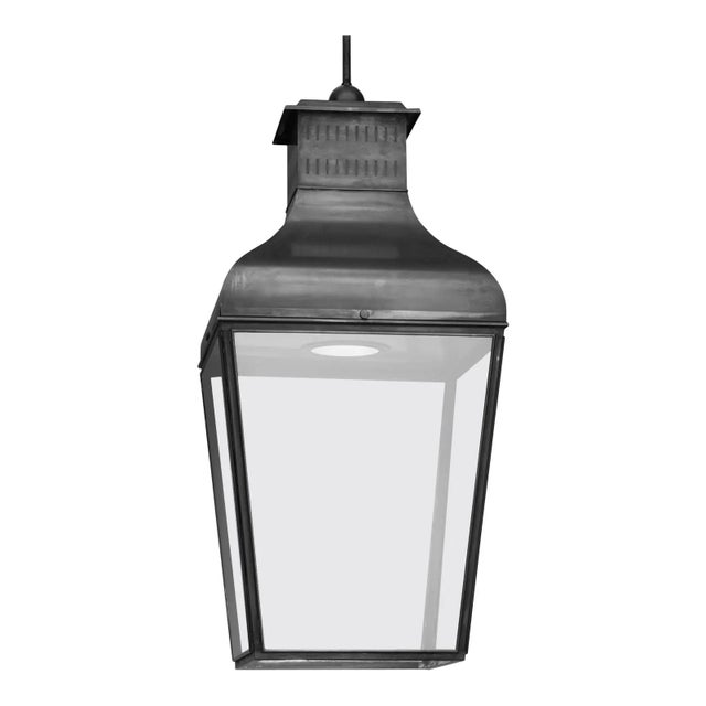 Hanging light in dark bronze with pagoda structure, closed top, outside fitted clear glass, water-resistant cable entry....