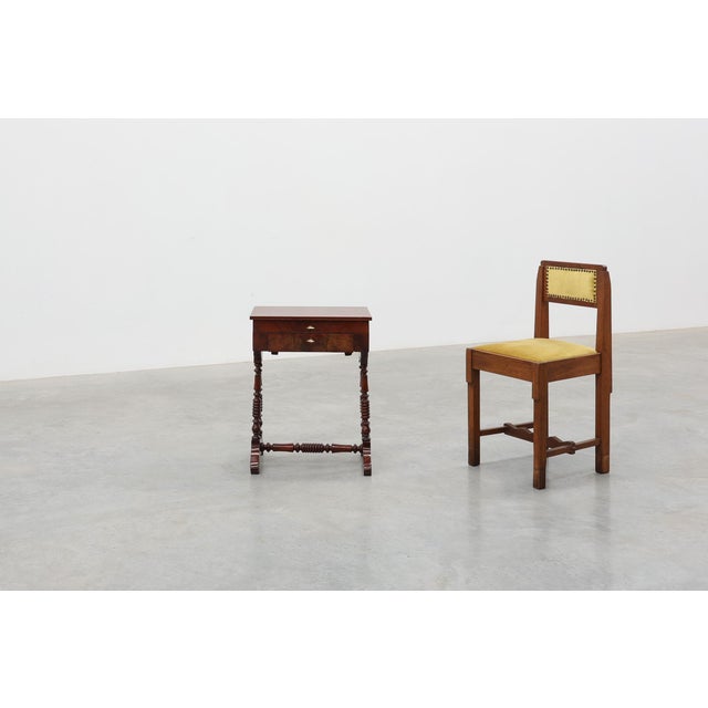 A charming French Louis Philippe side table dating from the mid-19th century, showcasing the elegant restraint and...