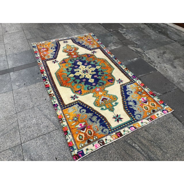 This is a vintage Turkish Oushak rug from the 1960s. The piece was hand-knotted.