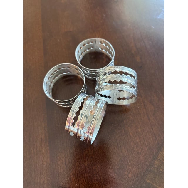 This is a wonderful vintage set of 4 Taxco Designer Sterling Silver Open Work Napkin Rings. The late 20th century set,...