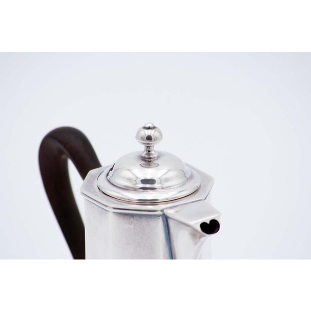 Silver Coffee Pot with Chestnut Handle, in Very Good conditions. Designed 1980 to 1989 This piece has an attribution mark,...
