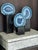 Elevate your space with this breathtaking, designer-grade set of 3 genuine Brazilian Blue Agate geode slices. Each crystal...