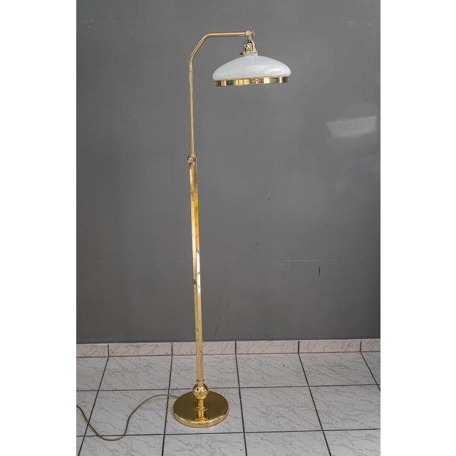Height adjustable from 132cm - 163cm Brass polished and stove enameled Opal glass shade European Plug (up to 250V).The...