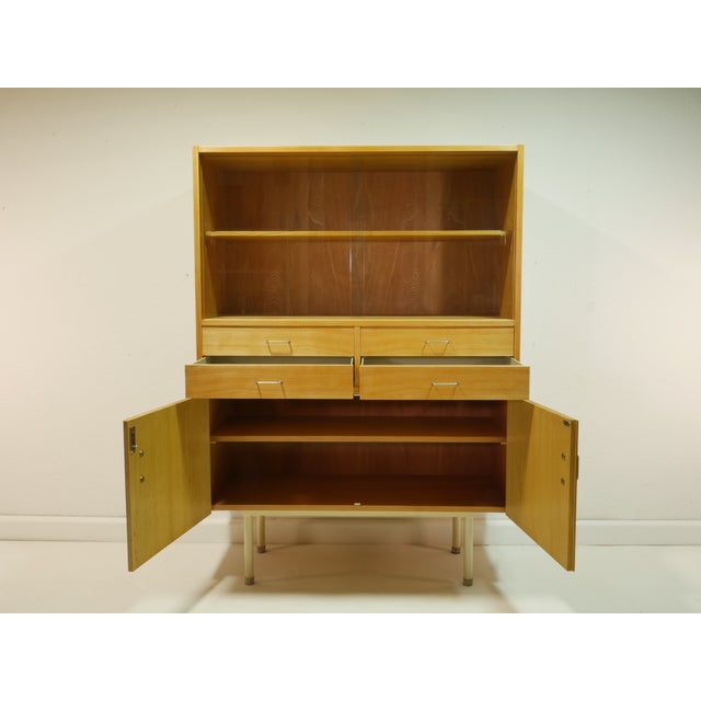 A simple and elegant vintage display cabinet from the 1960s in the Scandinavian Modern style. The piece impresses with its...