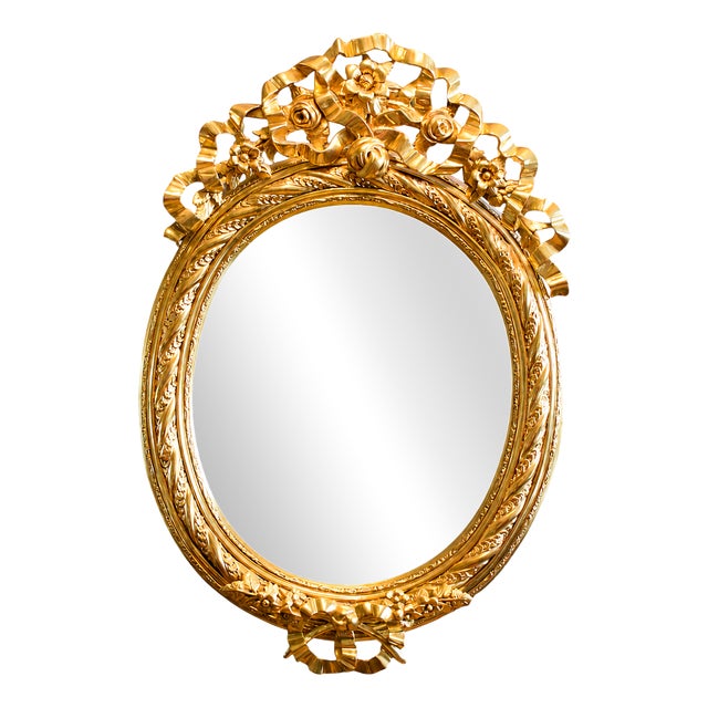 Mirror in Richly Decorated Gilded Frame For Sale