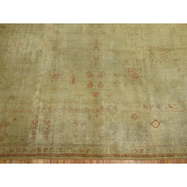 A 19th Century Room size Turkish Oushak Rug with an all-over design on a gray field. Professionally Cleaned and able to...
