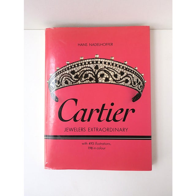 A hard-cover Cartier high jewelry coffee table book by Hans Nadelhoffer, 1984. Book showcases royal and high jewelry,...