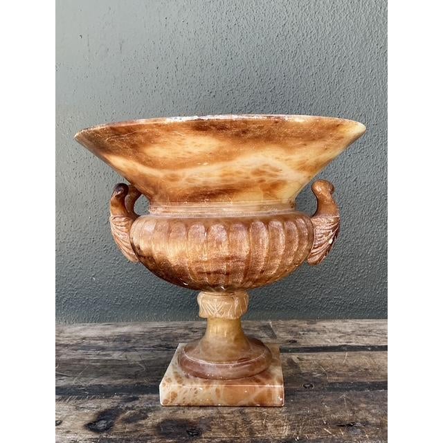 This exquisite hand-carved alabaster urn is a masterclass in Neoclassical design, channeling the timeless elegance of...