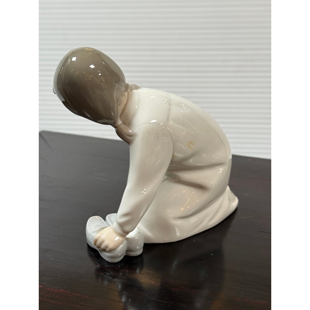 Design Plus Gallery presents the Porcelain Figurine Little Girl with Slippers by Vicente Martínez for Lladró. This is a...