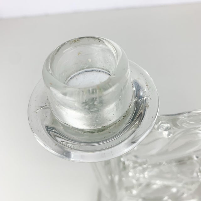 Stunning pair of glass candle holders with double arms and ivy vine details in the middle. Heavy. For standard tappers....