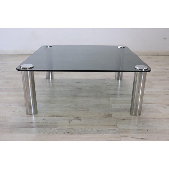This exquisite coffee table is a true testament to the elegant and innovative spirit of 20th century Italian design,...